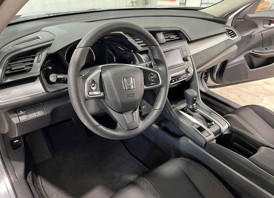 the interior of a honda civic is shown with the door open